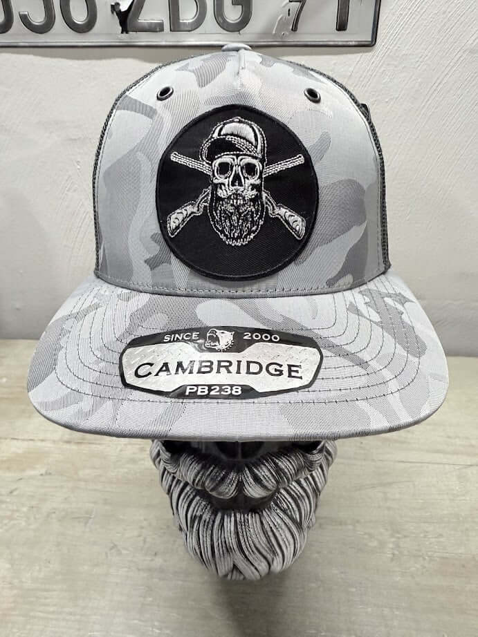 Bearded skull hunting trucker hat with embroidered design, stylish gray camouflage pattern and adjustable snapback.