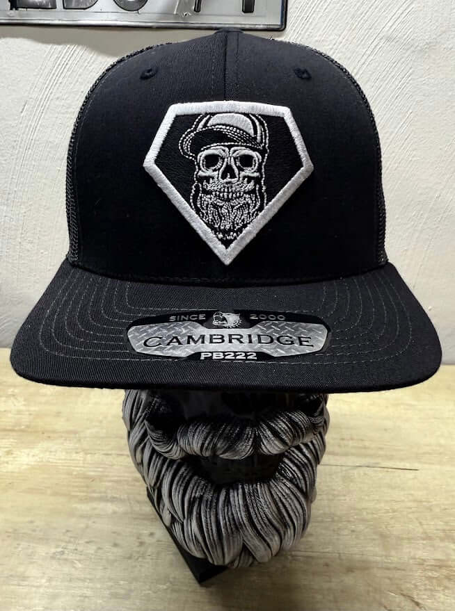 Super Beard Man Black Out Trucker Hat featuring skull design and sporty style, perfect for beard enthusiasts.