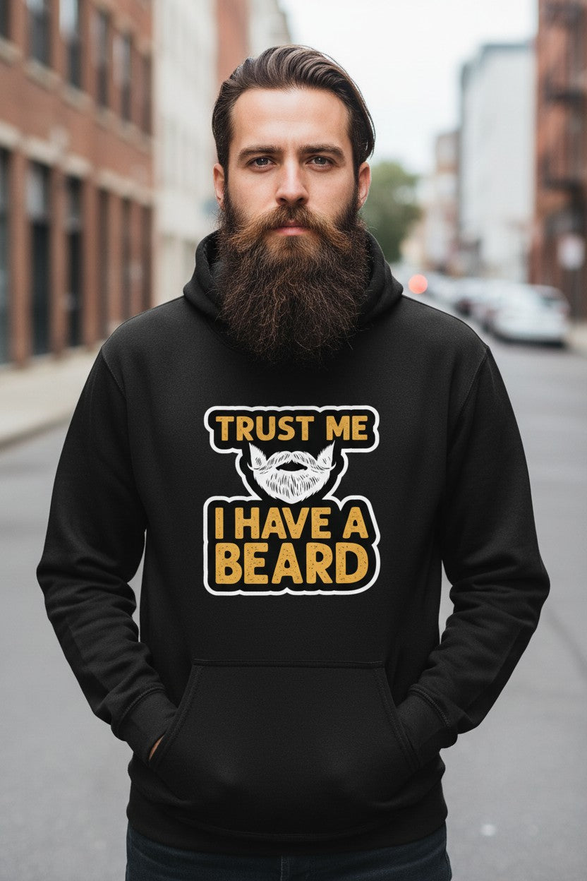 Man wearing a beard humor graphic hoodie with a bold 'Trust Me I Have A Beard' design in an urban setting.