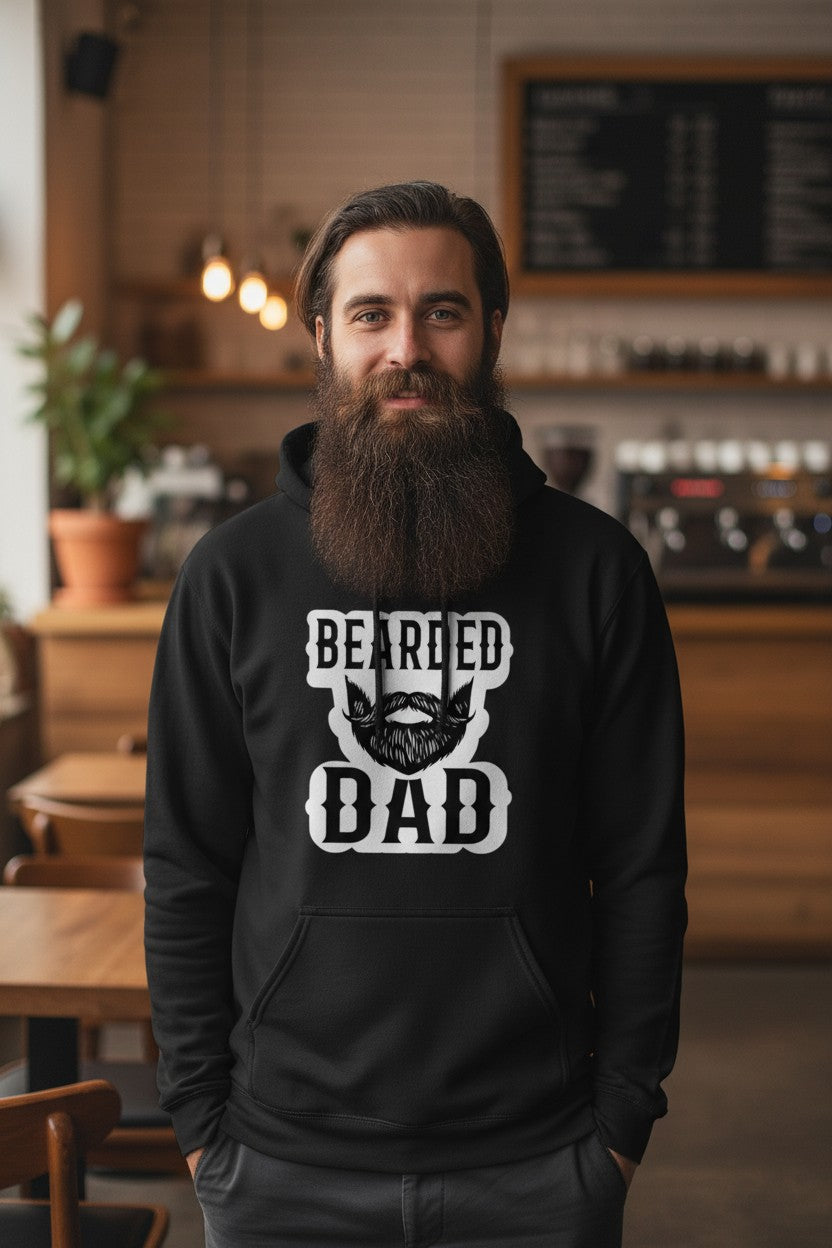 Bearded Dad hoodie featuring a stylish beard illustration and strong typography in a cozy cafe setting.